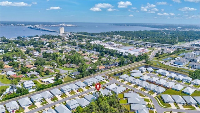 drone / aerial view with a residential view and a water view