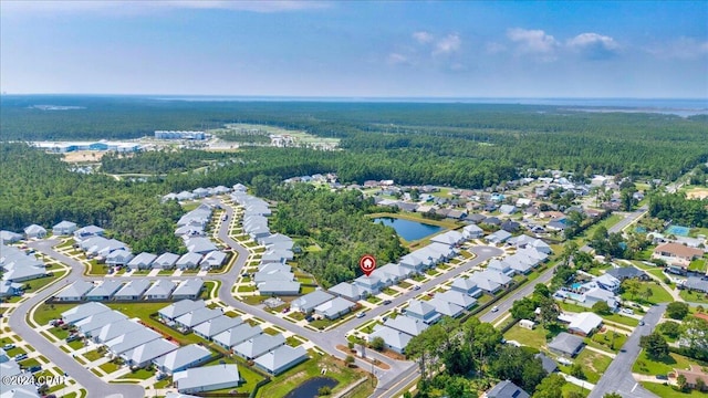 bird's eye view with a residential view, a forest view, and a water view