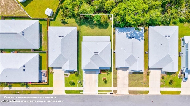 birds eye view of property with a residential view