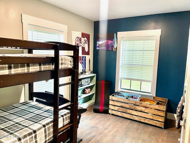 bedroom with wood finished floors