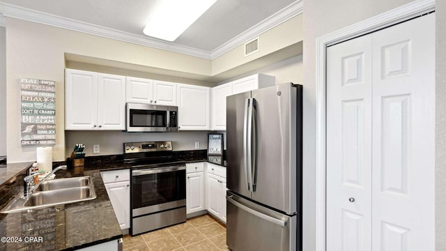 kitchen with ornamental molding, stainless steel appliances, sink, and white cabinets