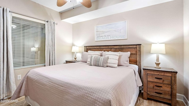 bedroom with light hardwood / wood-style floors and ceiling fan