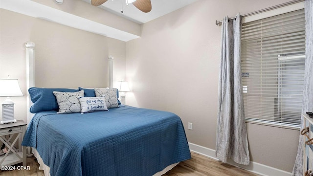 bedroom featuring light hardwood / wood-style floors and ceiling fan