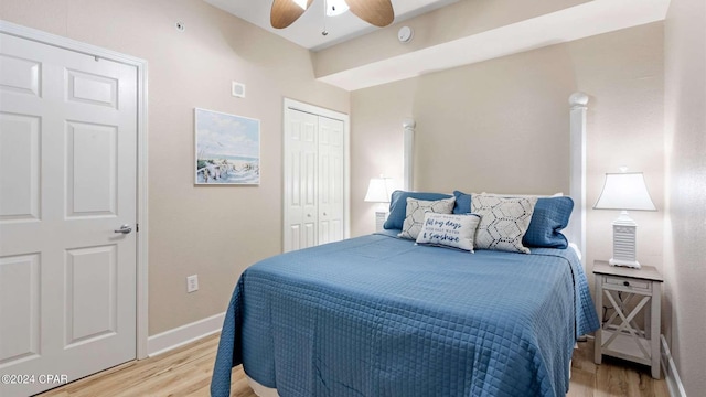 bedroom featuring a closet, ceiling fan, and light hardwood / wood-style flooring