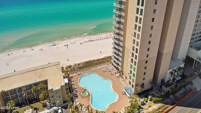 bird's eye view with a water view and a view of the beach