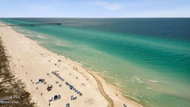 birds eye view of property featuring a view of the beach and a water view