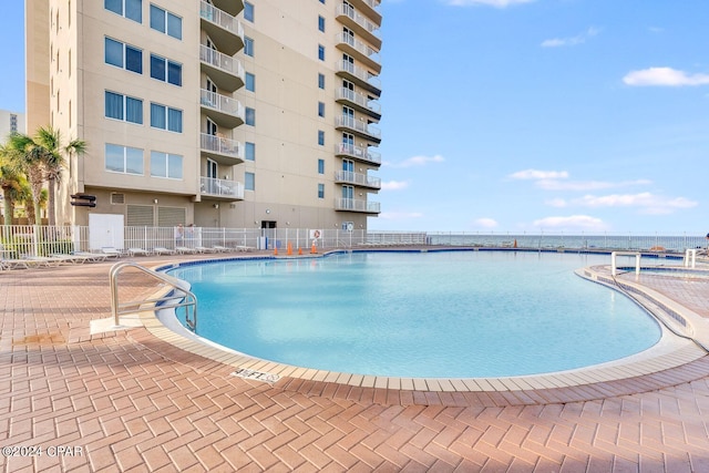 view of pool featuring a patio