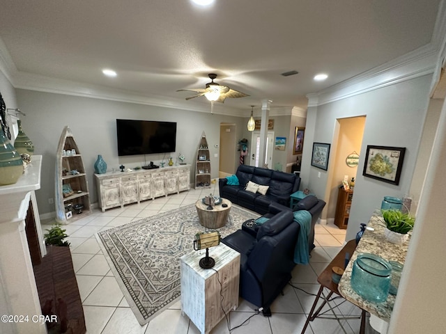 living room featuring ornamental molding, light tile patterned floors, and ceiling fan