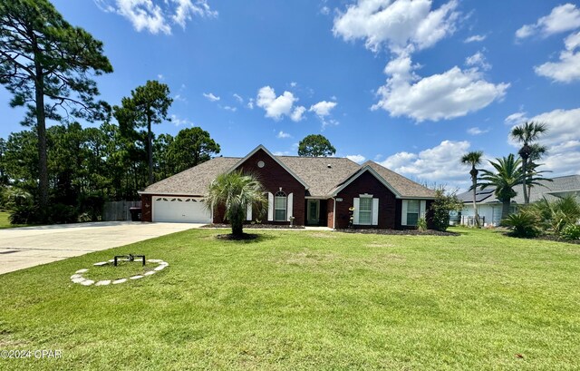 ranch-style house with a front yard and a garage