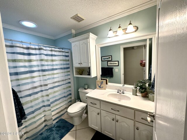 bathroom with a textured ceiling, vanity, toilet, ornamental molding, and tile patterned floors