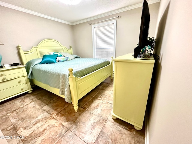 bedroom with ornamental molding and light tile patterned floors