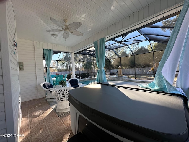 view of patio / terrace with glass enclosure and ceiling fan