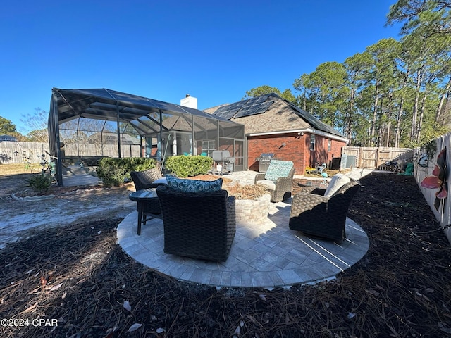 view of patio with glass enclosure