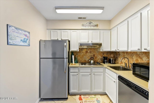 kitchen featuring white cabinetry, stainless steel appliances, and sink