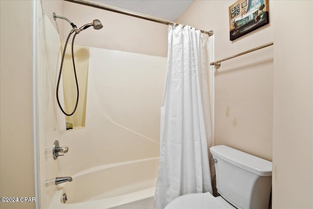 bathroom with toilet and shower / tub combo