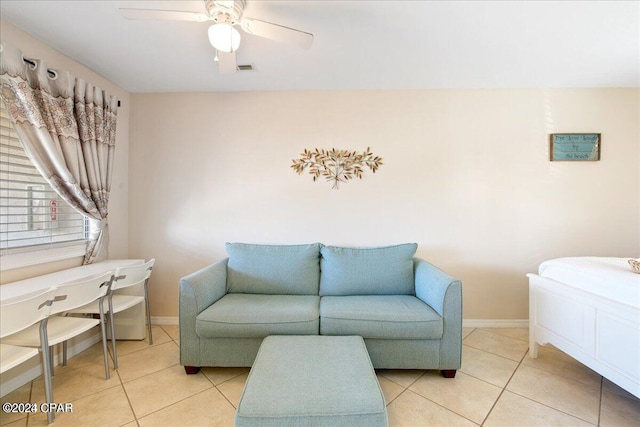 living room with light tile patterned floors and ceiling fan