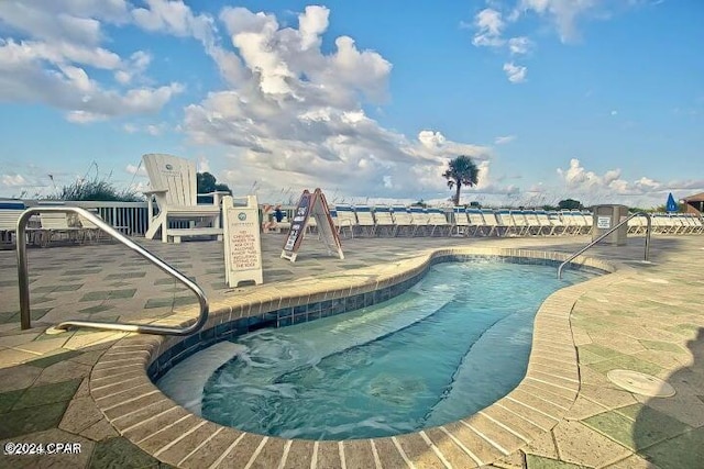 view of swimming pool featuring a patio area