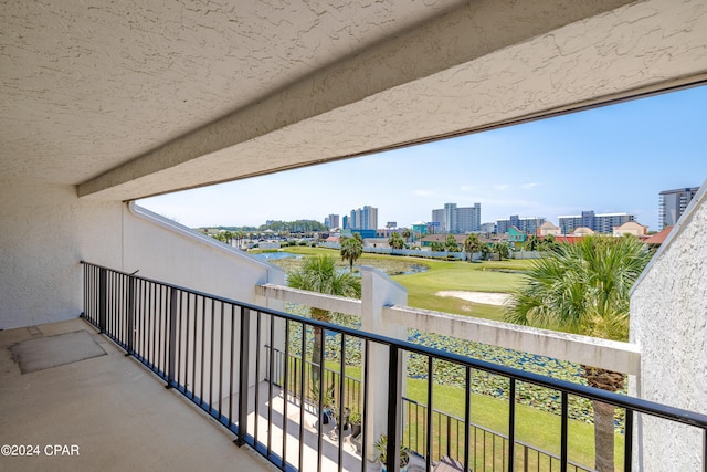 balcony featuring a water view