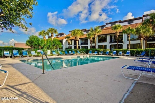 view of swimming pool with a patio