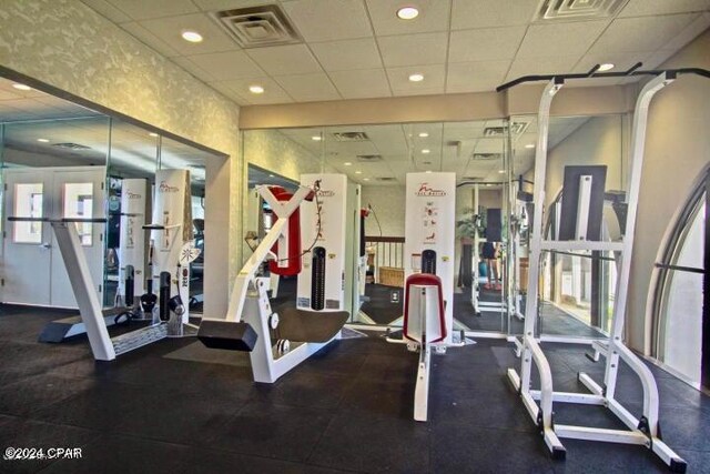 workout area featuring a drop ceiling