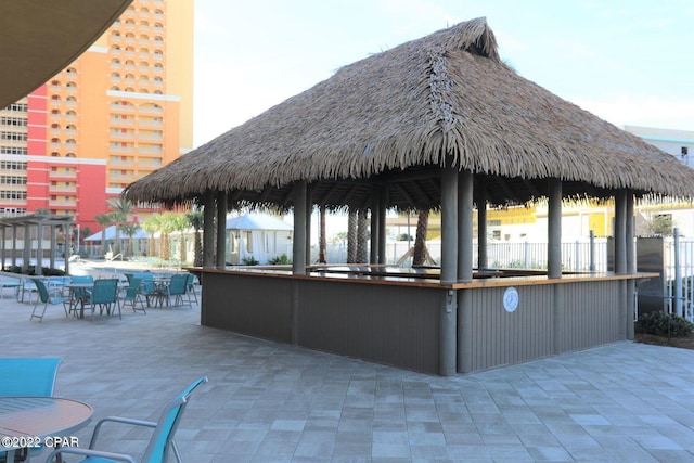 view of patio with a gazebo and exterior bar