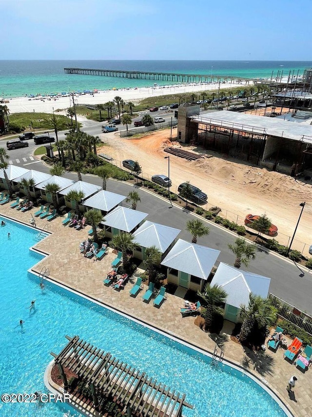 view of pool with a water view