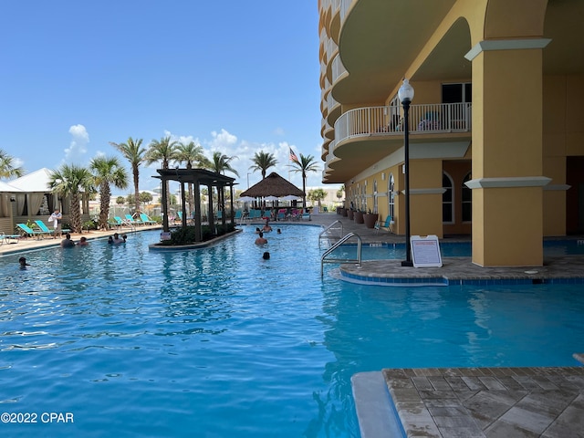 view of swimming pool with a patio area and a gazebo