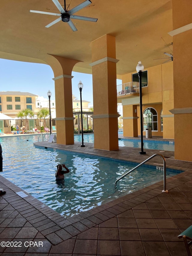 view of swimming pool with ceiling fan