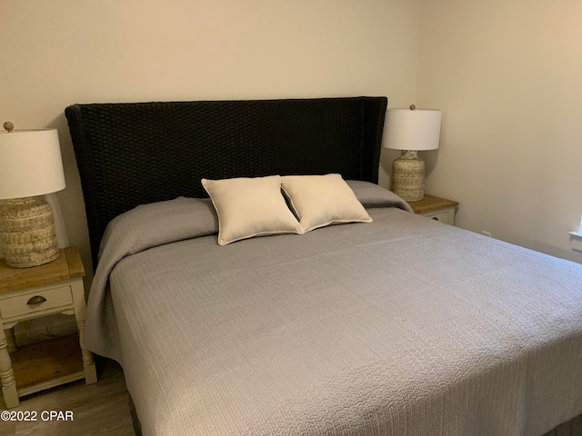 bedroom with hardwood / wood-style floors