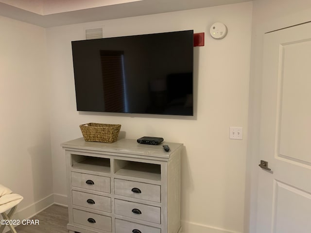 interior details featuring hardwood / wood-style flooring