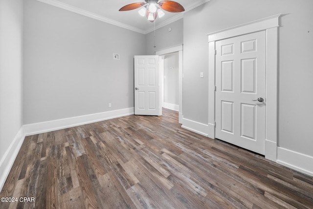 unfurnished bedroom featuring ceiling fan, crown molding, hardwood / wood-style flooring, and a closet