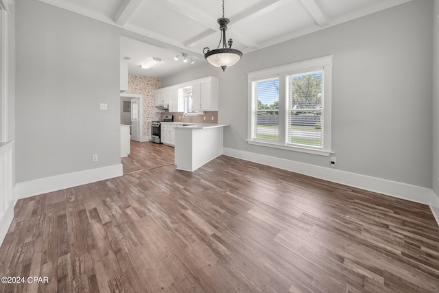 unfurnished living room with beam ceiling, wood-type flooring, and coffered ceiling