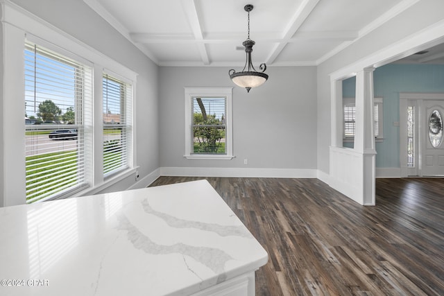 interior space featuring beam ceiling, ornate columns, coffered ceiling, and dark wood-type flooring