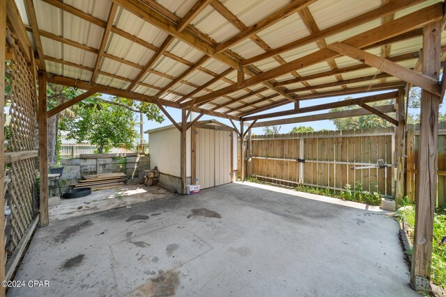 view of patio with a storage shed