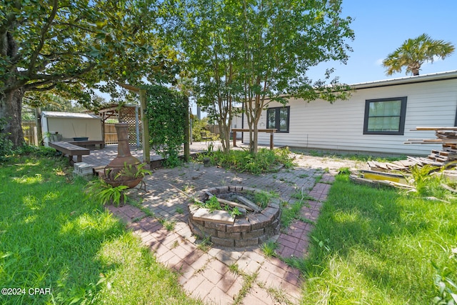 view of yard with a wooden deck and a patio area