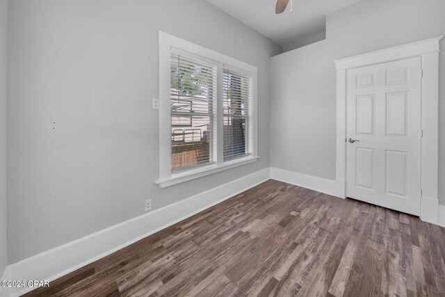 spare room with ceiling fan and hardwood / wood-style flooring