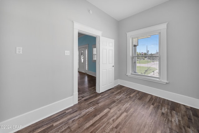 spare room featuring dark hardwood / wood-style floors