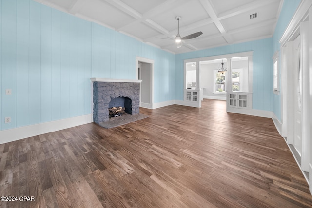 unfurnished living room with coffered ceiling, wood-type flooring, ceiling fan, beam ceiling, and a fireplace