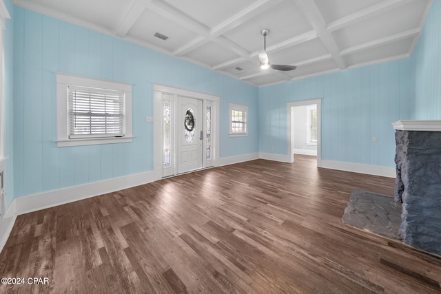 unfurnished living room featuring coffered ceiling, wood-type flooring, ceiling fan, beam ceiling, and a premium fireplace