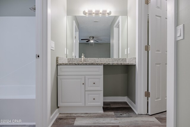 bathroom with vanity, wood-type flooring, and ceiling fan