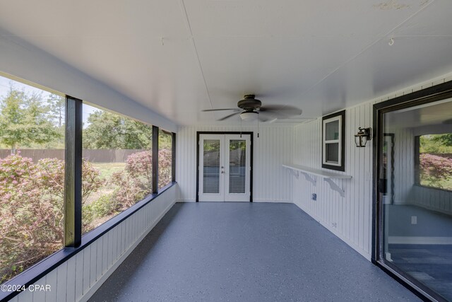 unfurnished sunroom featuring french doors and ceiling fan