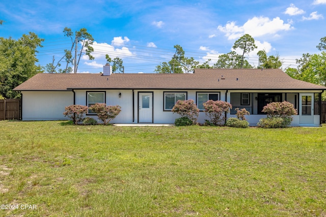 ranch-style house featuring a front lawn