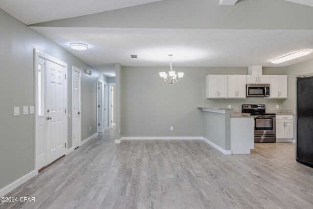 kitchen with hanging light fixtures, light hardwood / wood-style floors, stainless steel appliances, lofted ceiling, and white cabinets