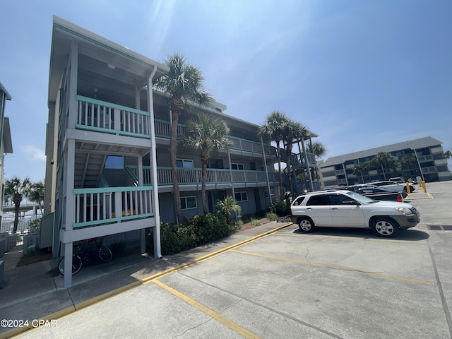 view of property with uncovered parking