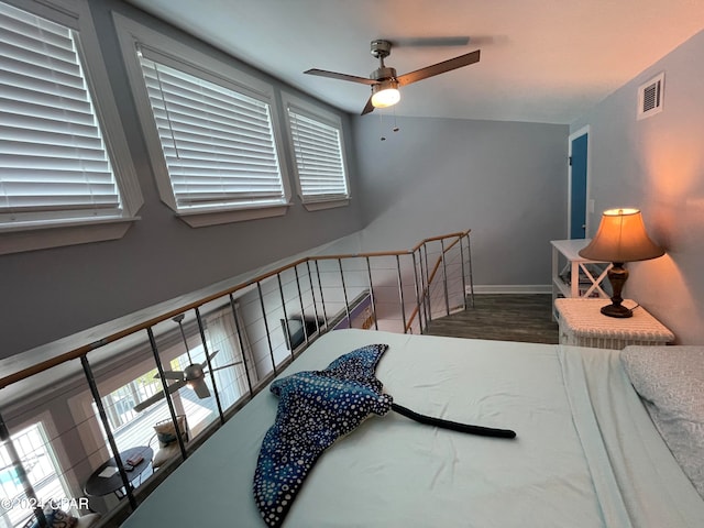 bedroom featuring hardwood / wood-style floors and ceiling fan