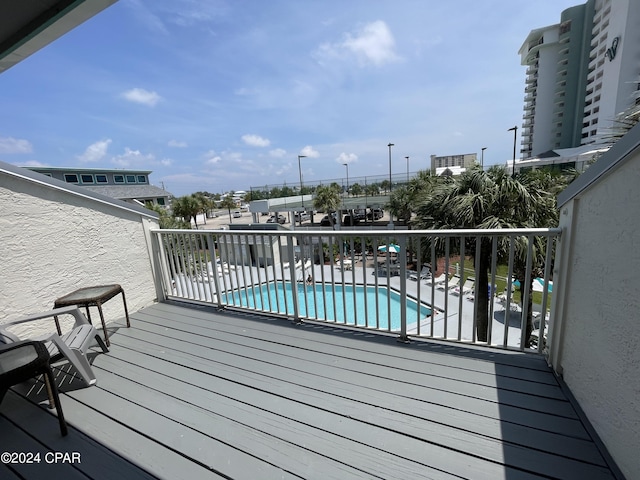 deck with a community pool