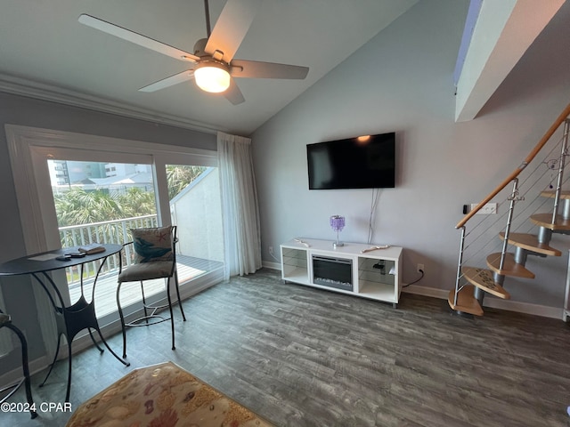 living room featuring ceiling fan, lofted ceiling, and wood-type flooring