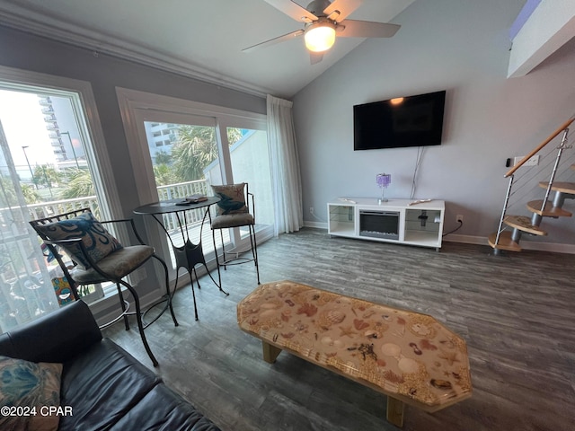 living room featuring hardwood / wood-style floors, vaulted ceiling, and ceiling fan