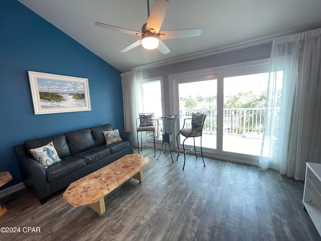 living room with ceiling fan, lofted ceiling, and hardwood / wood-style floors