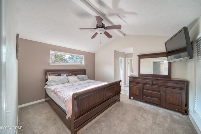 bedroom with vaulted ceiling with beams, a textured ceiling, light colored carpet, a ceiling fan, and baseboards